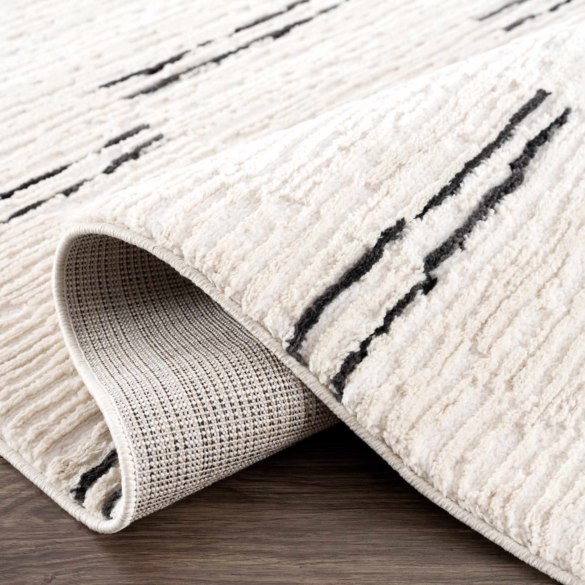 Riad Black Striped White Rug with Tassels
