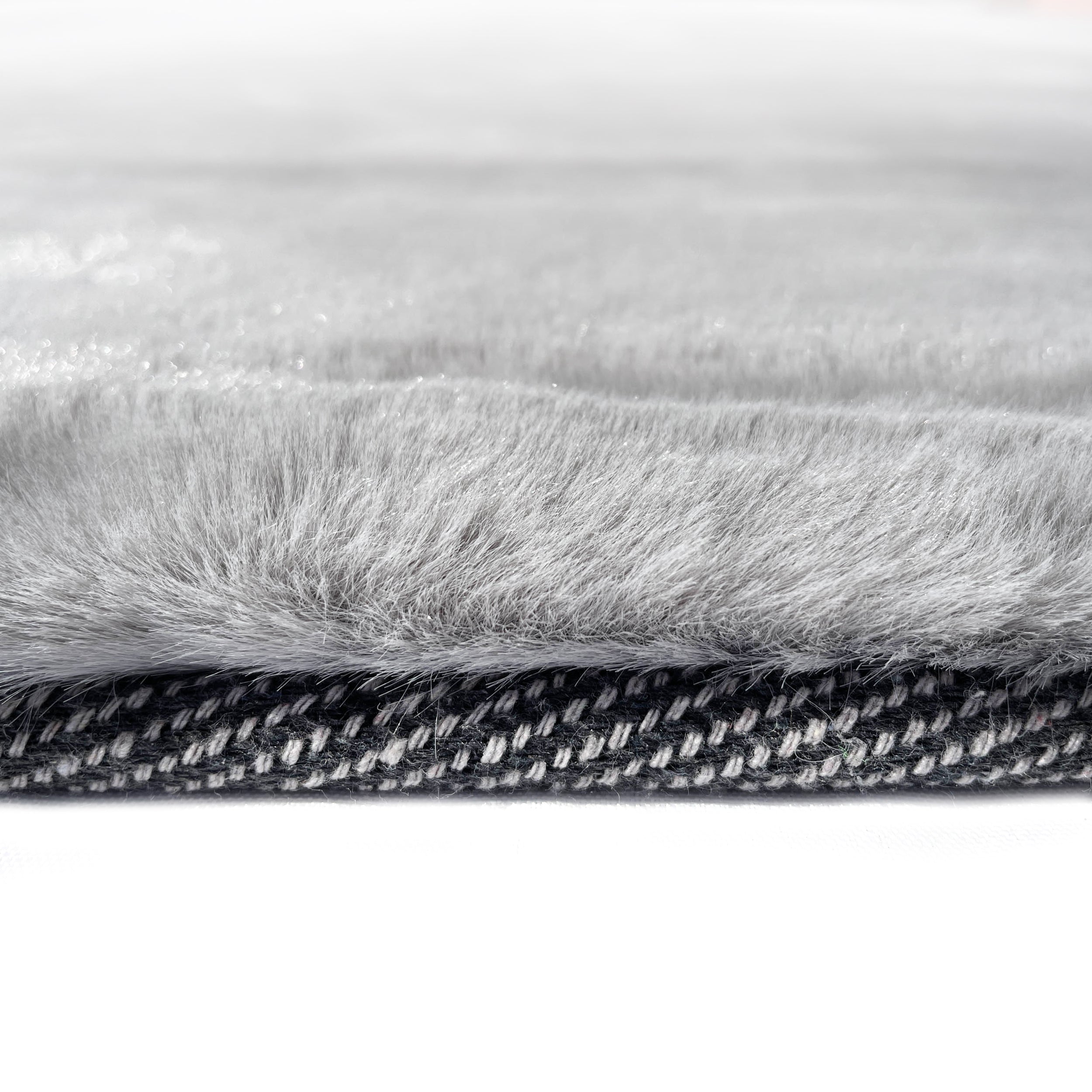 Rabbit Smoke Gray Faux Fur Area Rug - Plush and luxurious smoke gray faux fur rectangular rug from the Rabbit collection by LA Rug Linens. Available in various sizes. Made of polyester. Perfect for adding warmth and elegance to any room in your home.