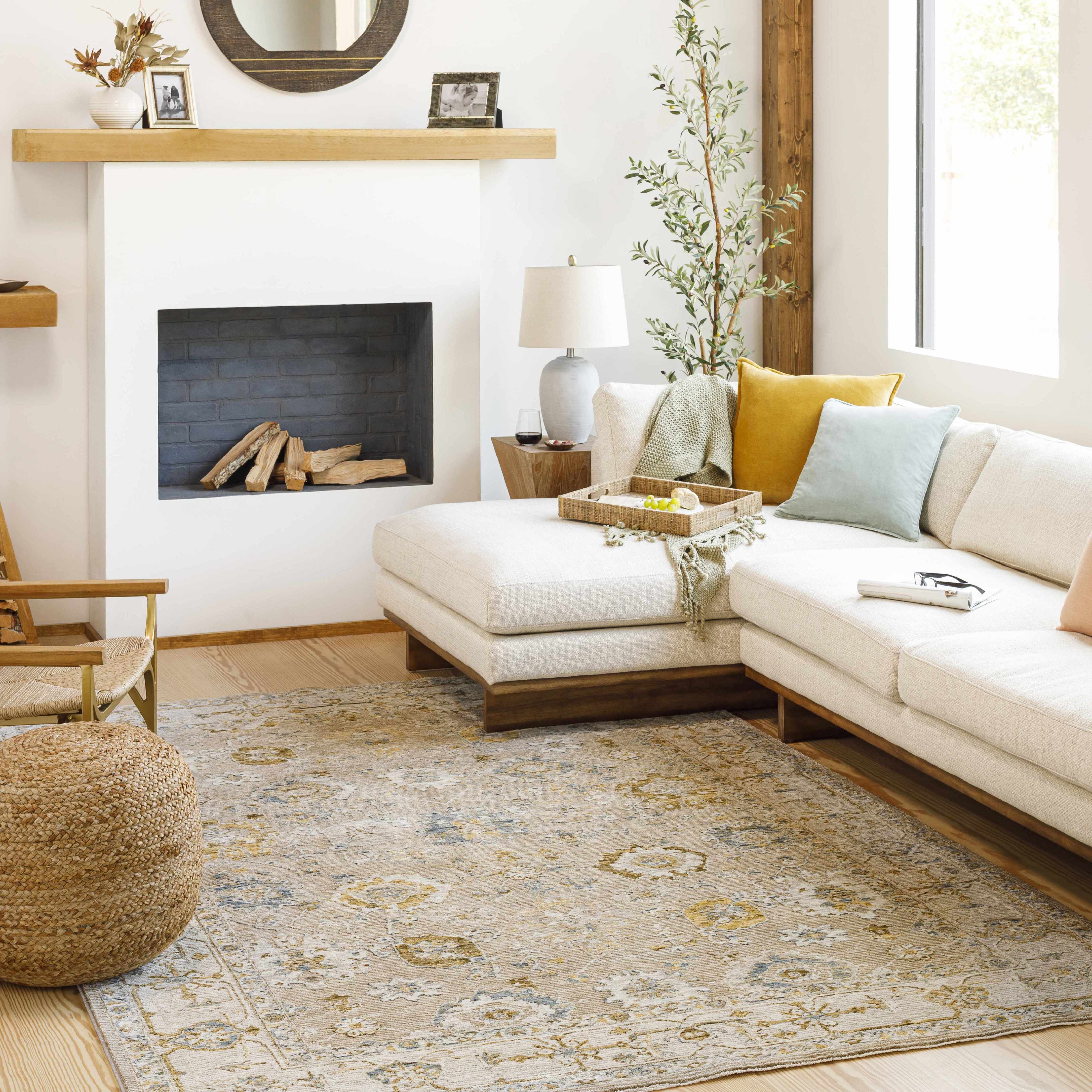 Living room with a sectional sofa, rug, and fireplace